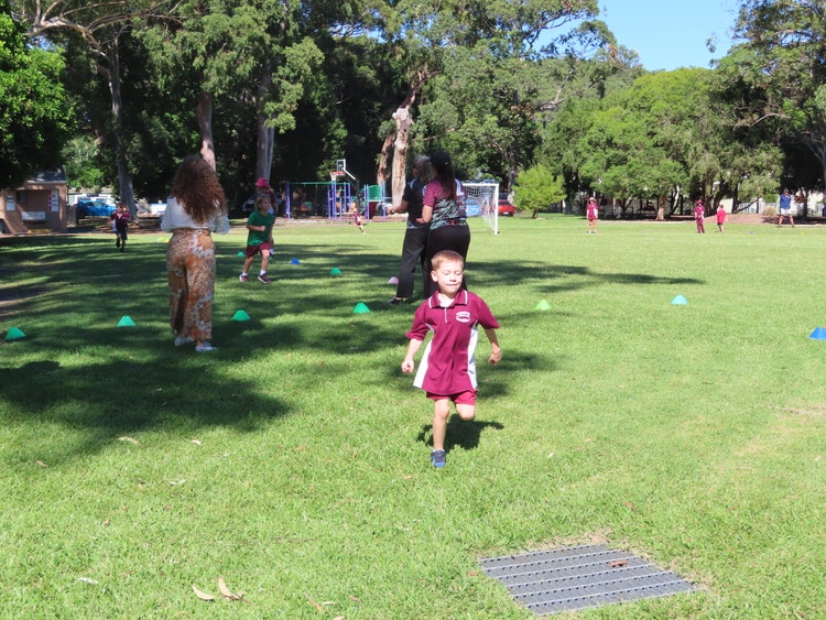 A young student on a sports field.