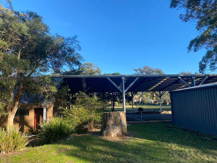 school grounds with shed and COLA in background